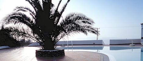 Seasonal outdoor pool, open 9:00 AM to 8:00 PM, free pool cabanas