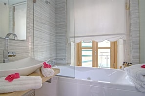 Luxury Room | Bathroom | Deep soaking tub, hair dryer, bathrobes, slippers