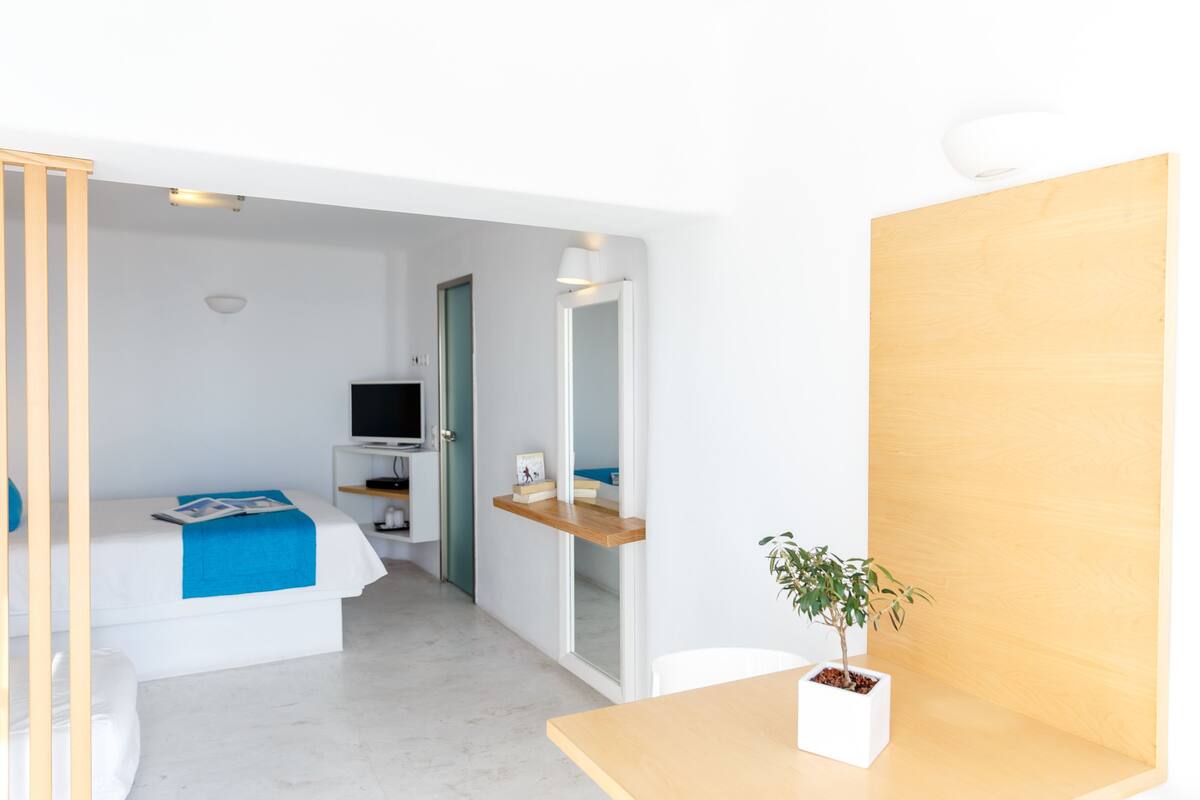 triple room caldera view, sea view | pillow-top beds, in-room safe, soundproofing, iron/ironing board