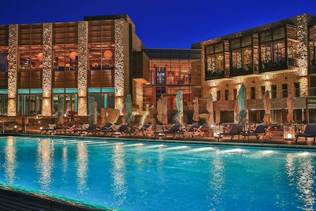 Indoor pool, seasonal outdoor pool, pool umbrellas, sun loungers