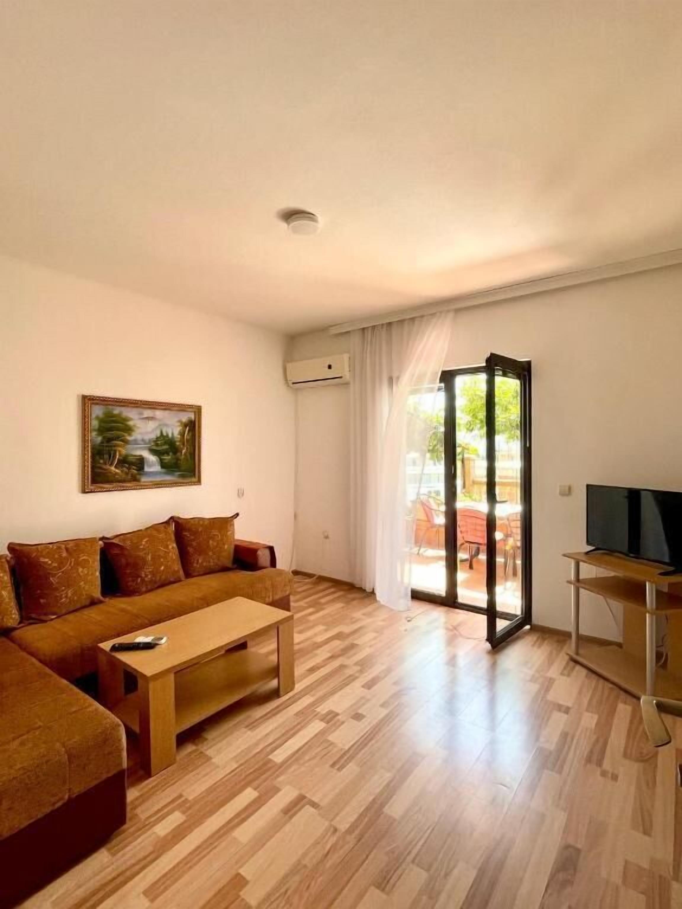 Basic Apartment, 1 Bedroom, Balcony, Partial Sea View | Living area | TV