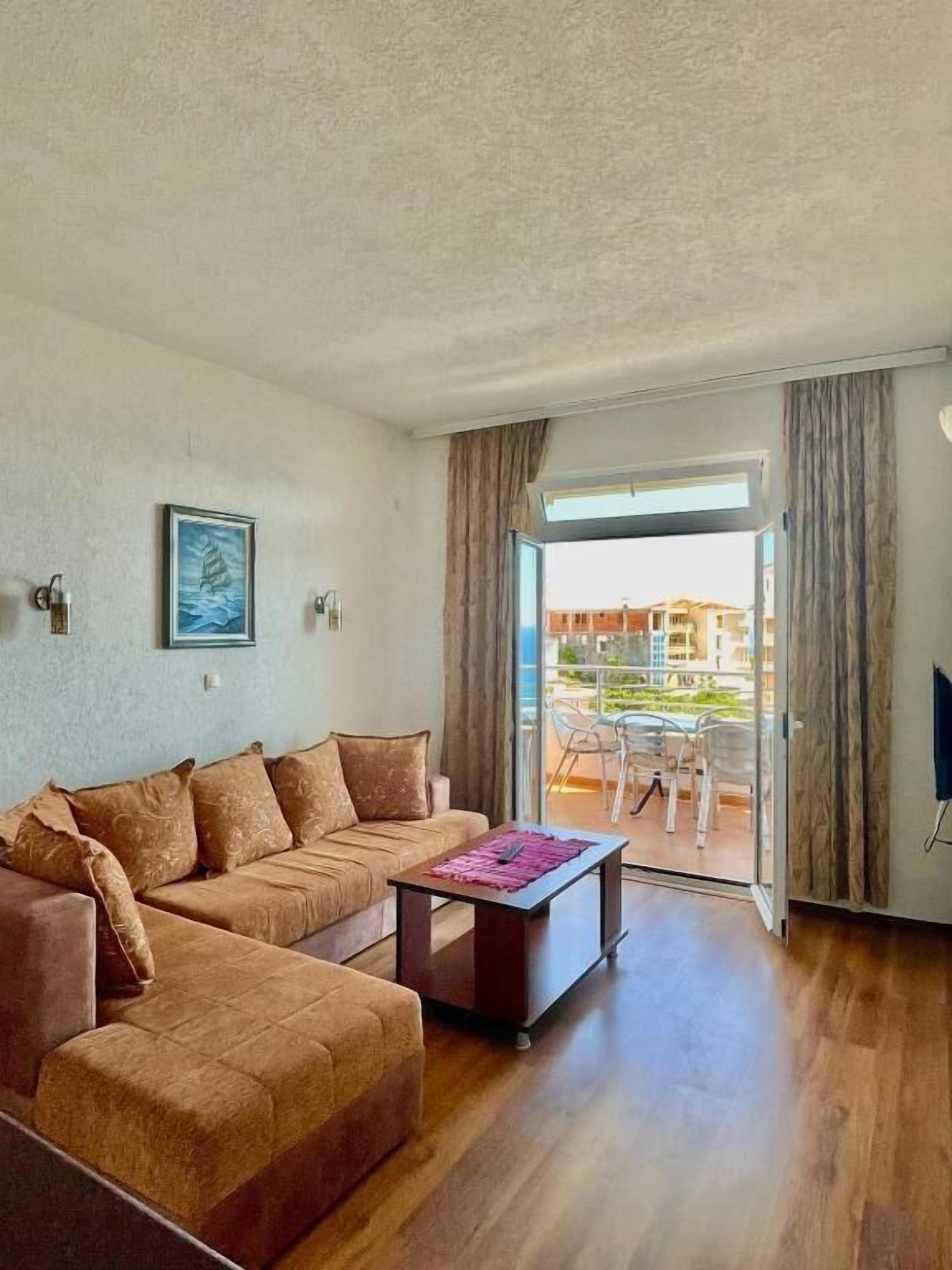 Apartment, 1 Bedroom, Balcony, Sea View | Living area | TV