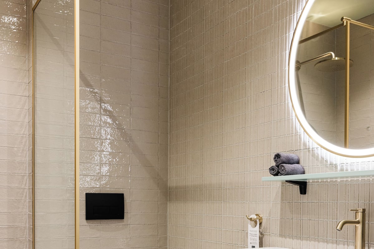 Junior Suite | Bathroom | Designer toiletries, hair dryer, bathrobes, slippers