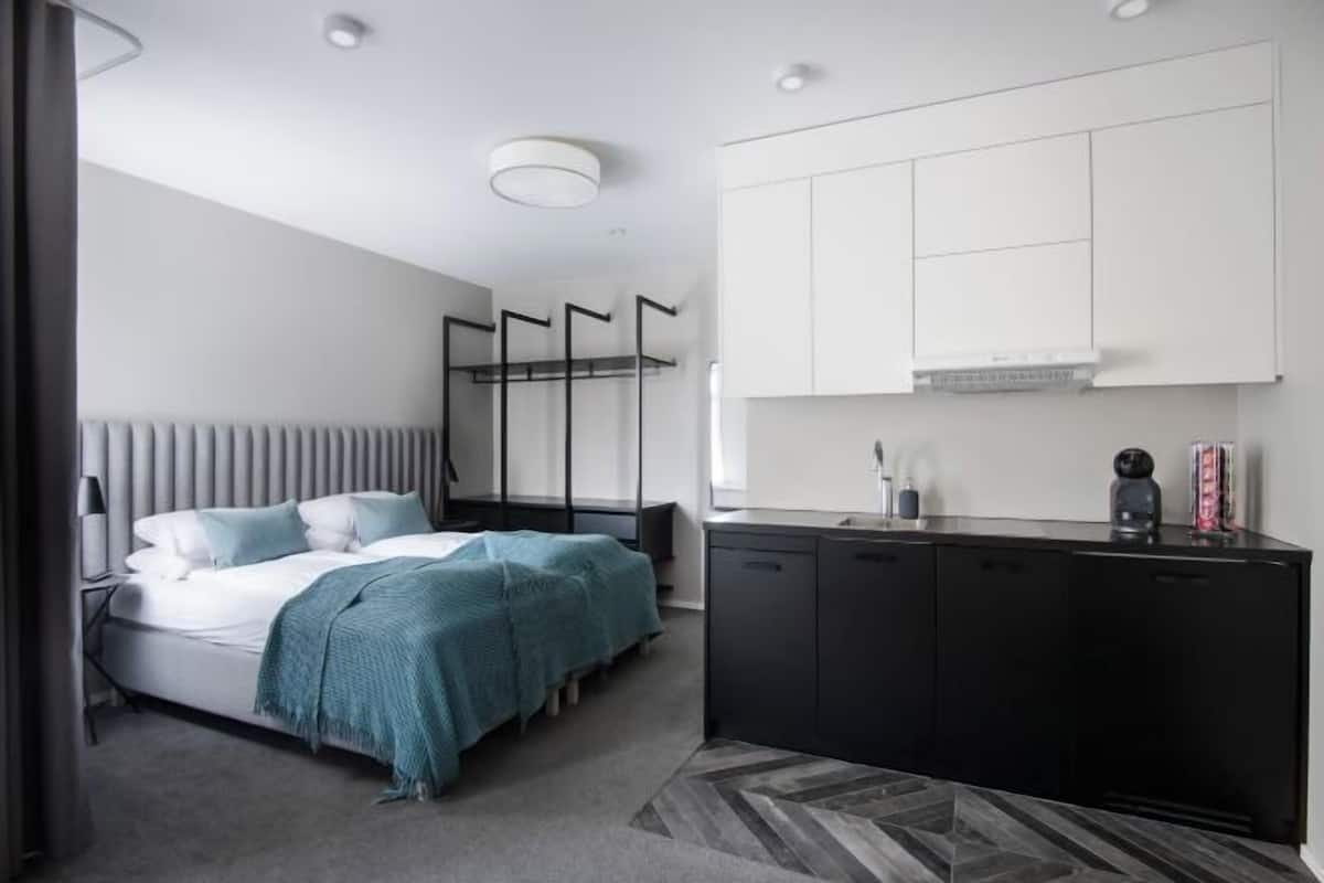 Hypo-allergenic bedding, down duvets, pillow-top beds, in-room safe