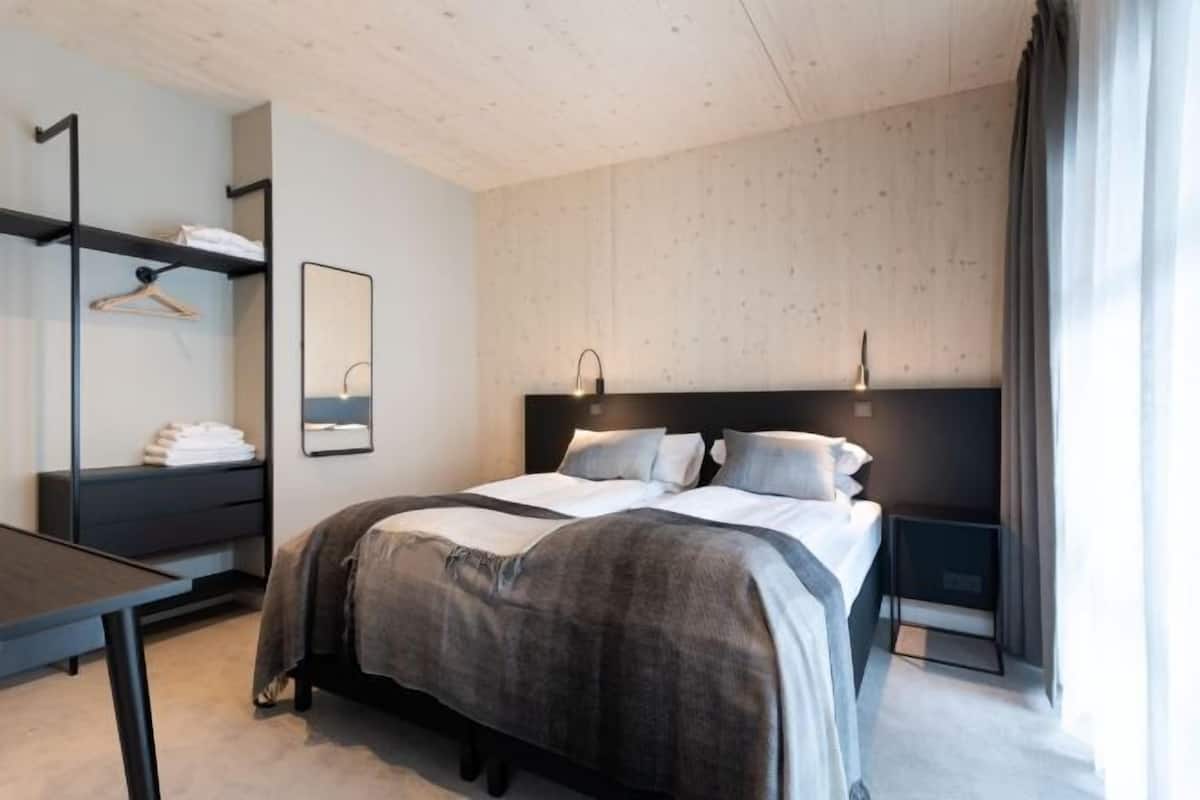 Hypo-allergenic bedding, down duvets, pillow-top beds, in-room safe