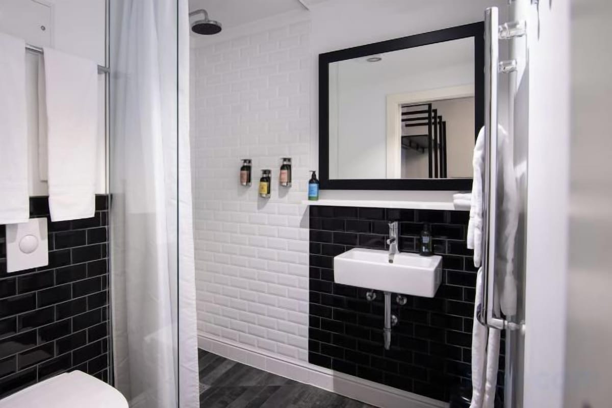 Designer toiletries, hair dryer, bathrobes, slippers