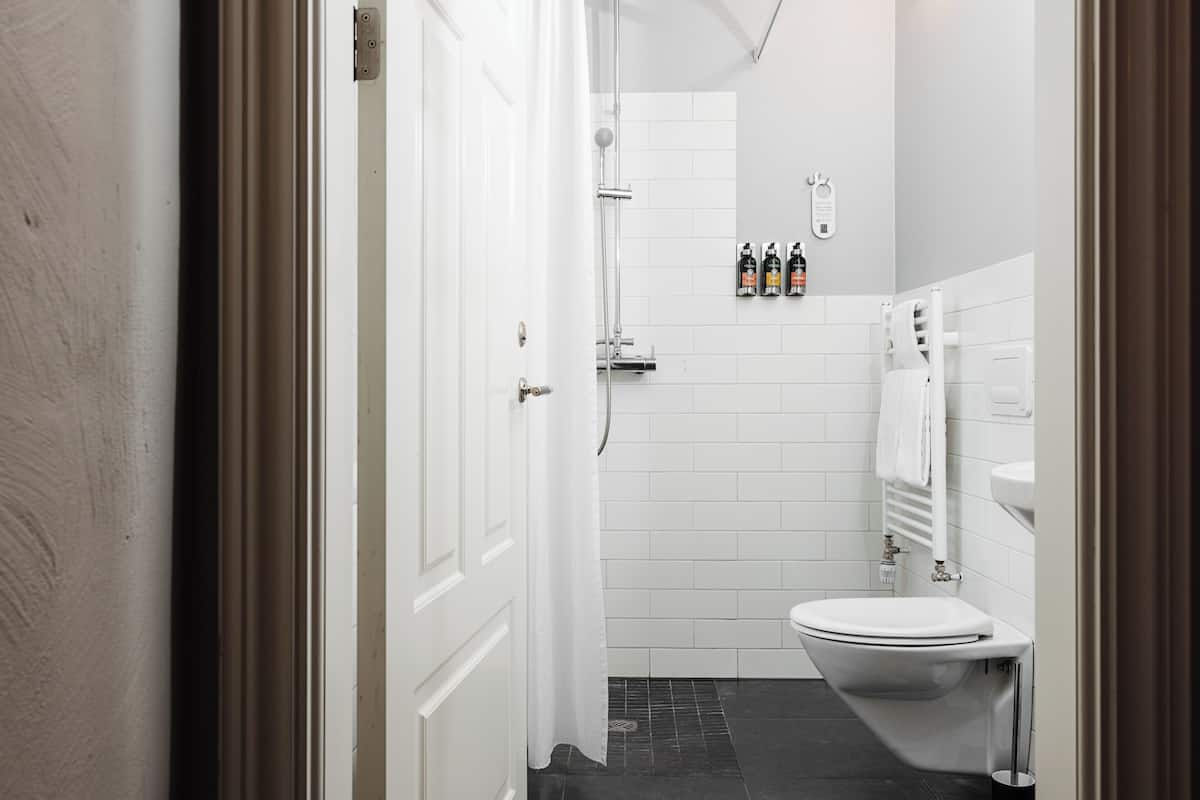 Economy Studio | Bathroom | Designer toiletries, hair dryer, bathrobes, slippers