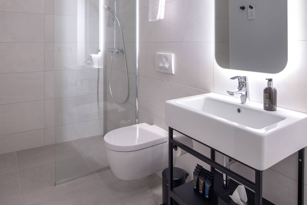 Family Suite | Bathroom | Designer toiletries, hair dryer, bathrobes, slippers