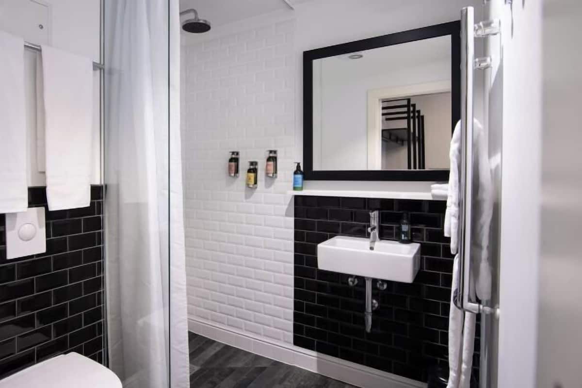 Designer toiletries, hair dryer, bathrobes, slippers