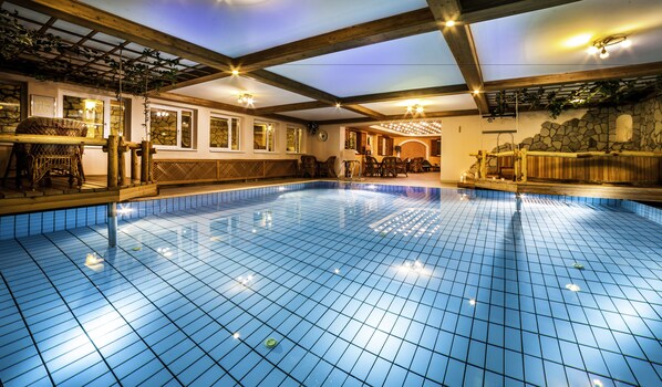 Indoor pool, open 8:00 AM to 8:00 PM, pool loungers