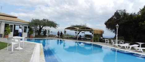Outdoor pool, pool umbrellas, pool loungers