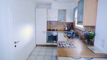 Basic Apartment, 2 Bedrooms, Garden View | Private kitchen | Fridge, microwave, stovetop, coffee/tea maker