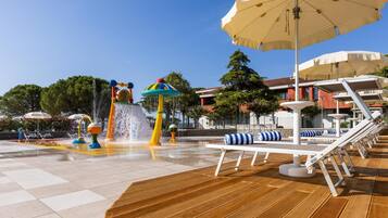 Relax by the water play area with its vibrant features and comfortable seating.