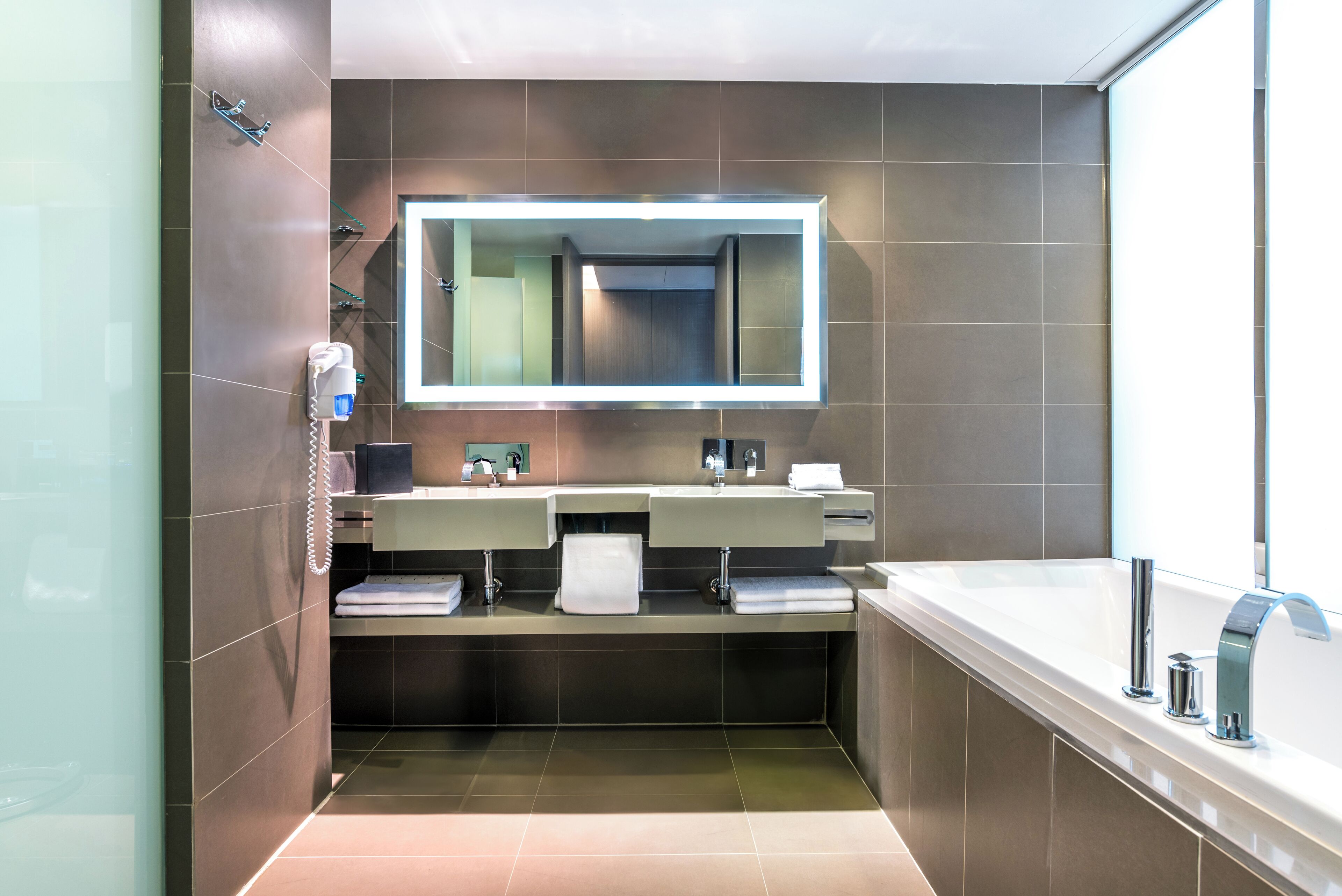 suite, 1 king bed, non smoking | bathroom | hydromassage showerhead, eco-friendly toiletries, hair dryer, bathrobes