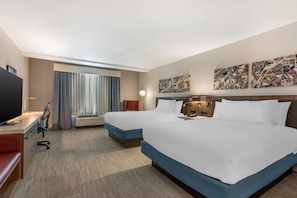 A hotel room with two beds, a desk with a computer, a TV, and a large window with curtains. - Hilton Garden Inn Columbia Northeast (Columbia)