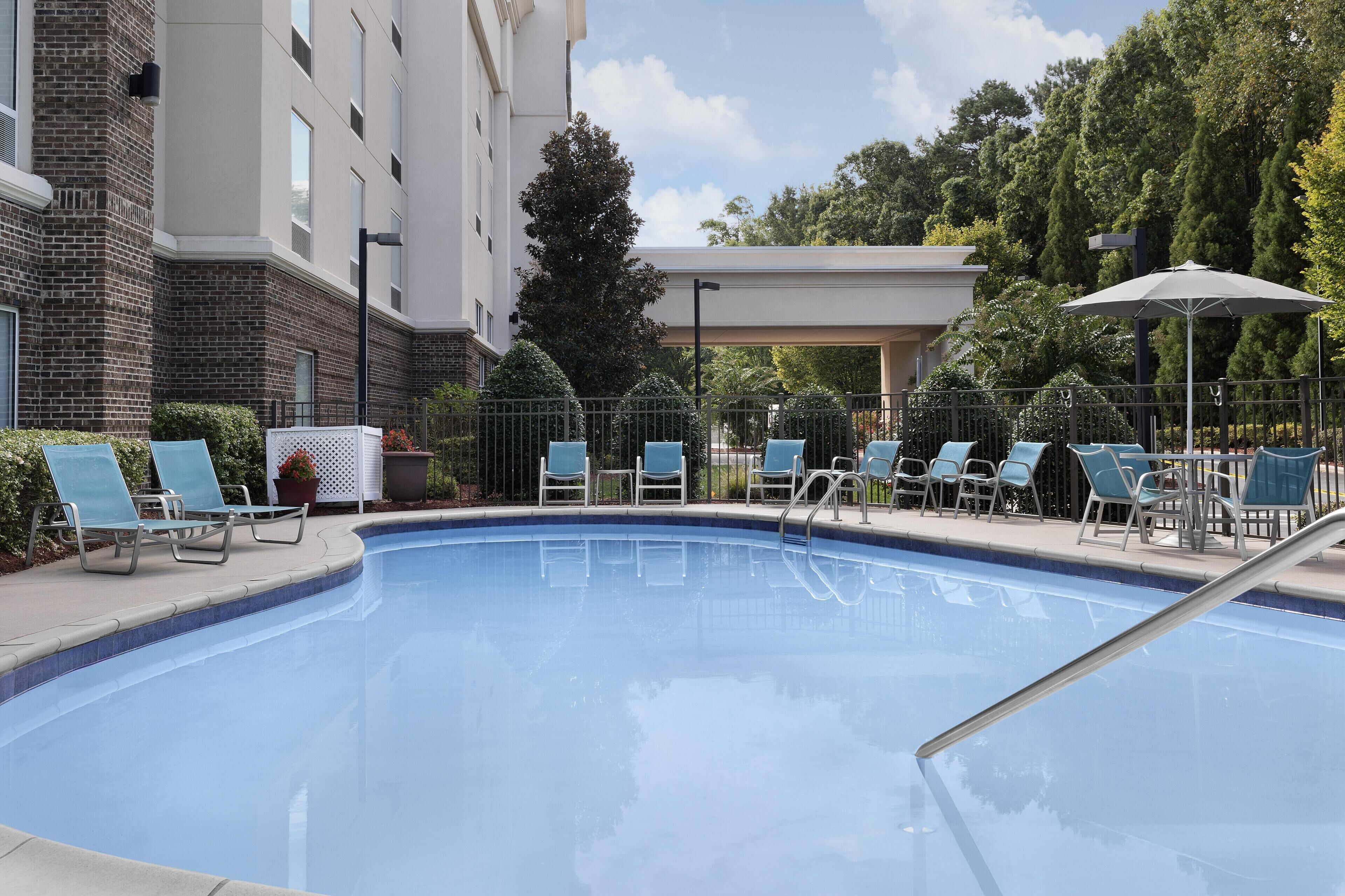 Seasonal outdoor pool, open 9:00 AM to 10:00 PM, pool umbrellas