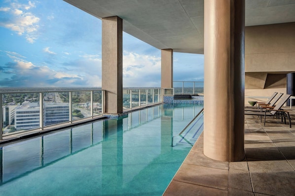 Outdoor pool, open 6:00 AM to 11:00 PM, sun loungers