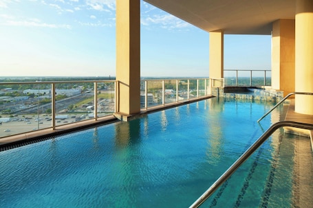 Outdoor pool, open 6:00 AM to 11:00 PM, sun loungers