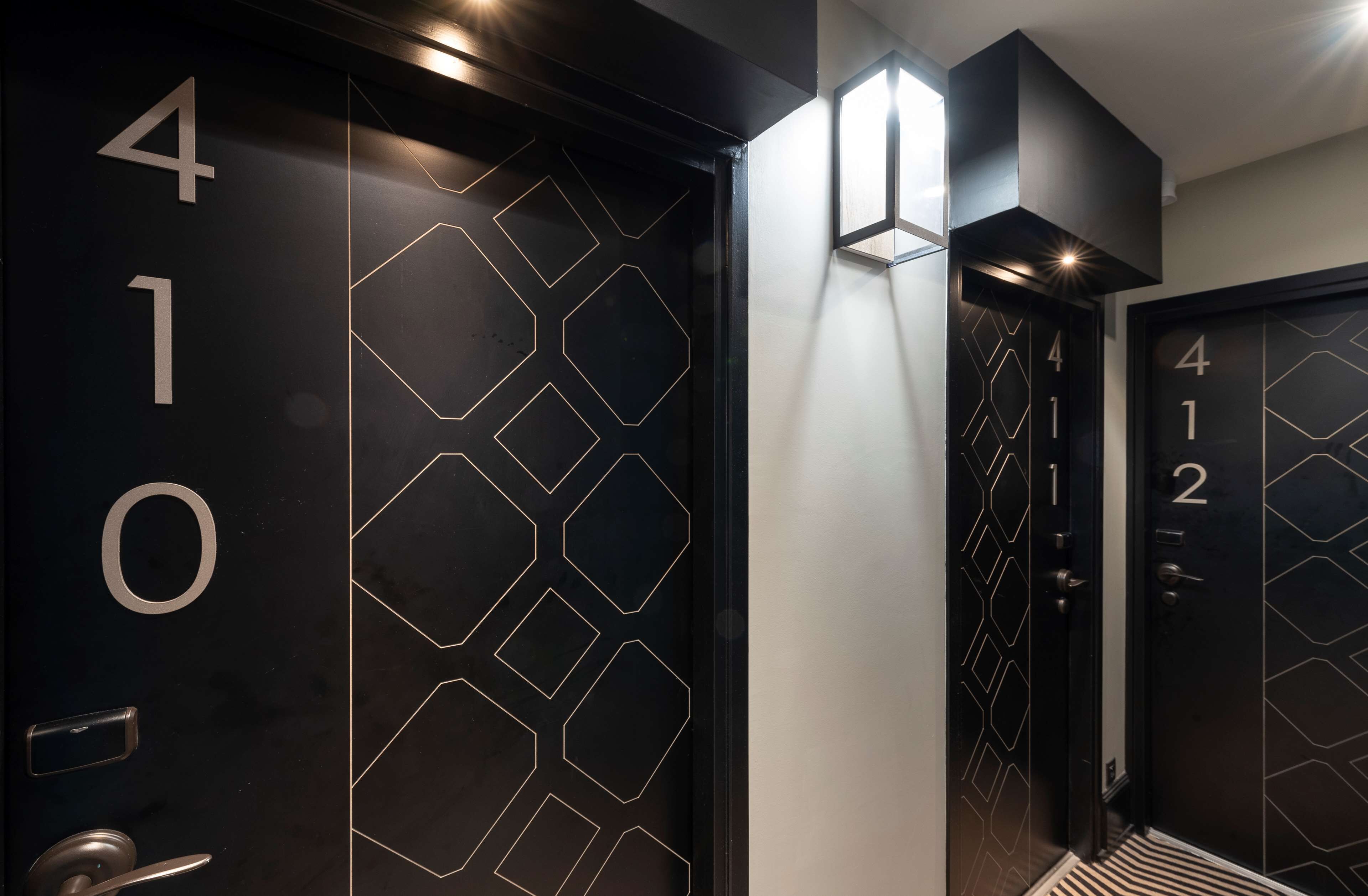 A modern elevator with geometric patterns and numbers indicating floors.
