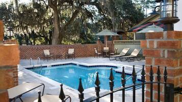 Seasonal outdoor pool, open 9:00 AM to 9:00 PM, pool umbrellas