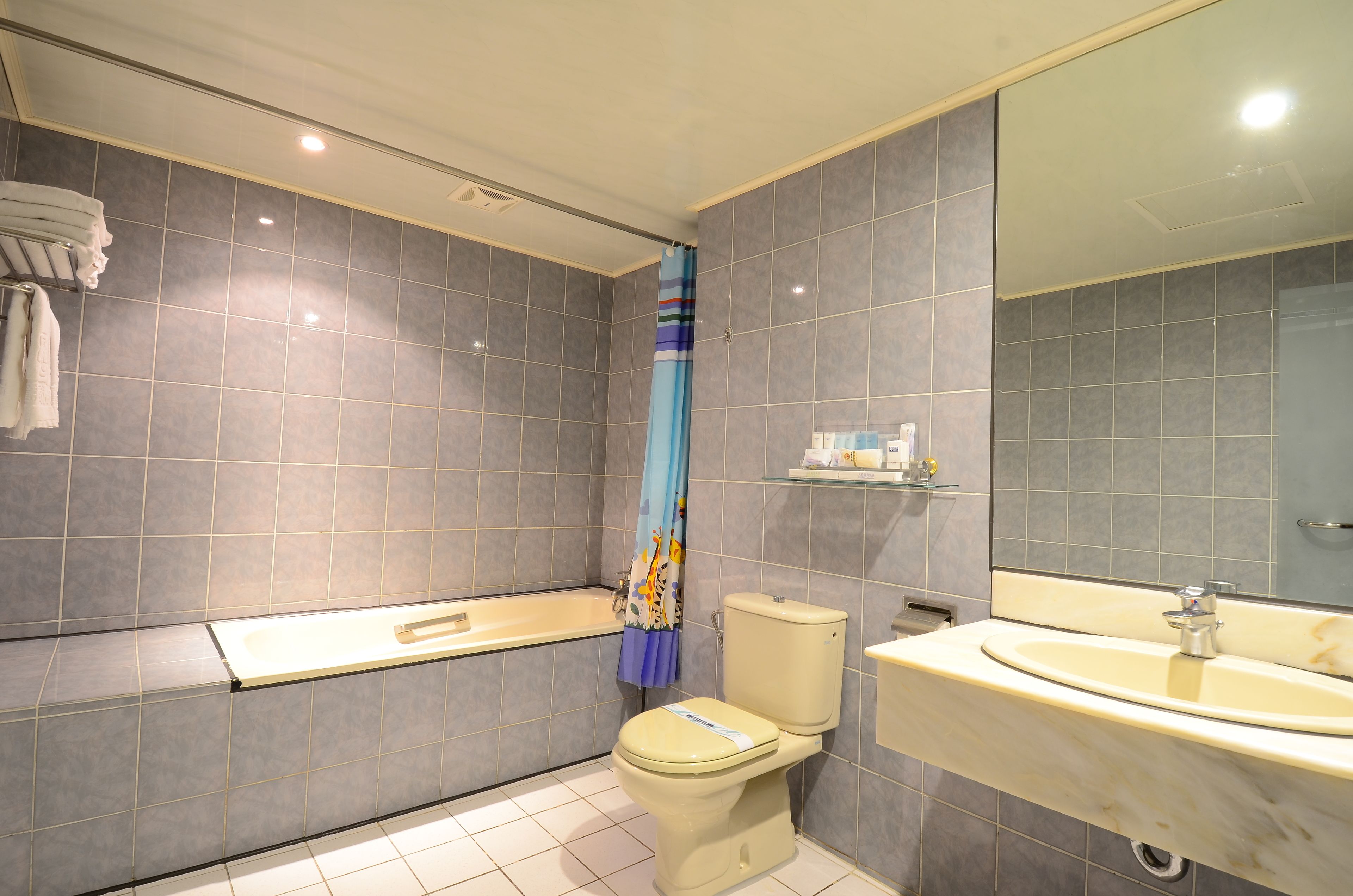 family quadruple room, 2 queen beds | bathroom | shower, free toiletries, hair dryer, slippers