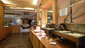 A buffet area with clear signage for the restaurant and buffet directions.