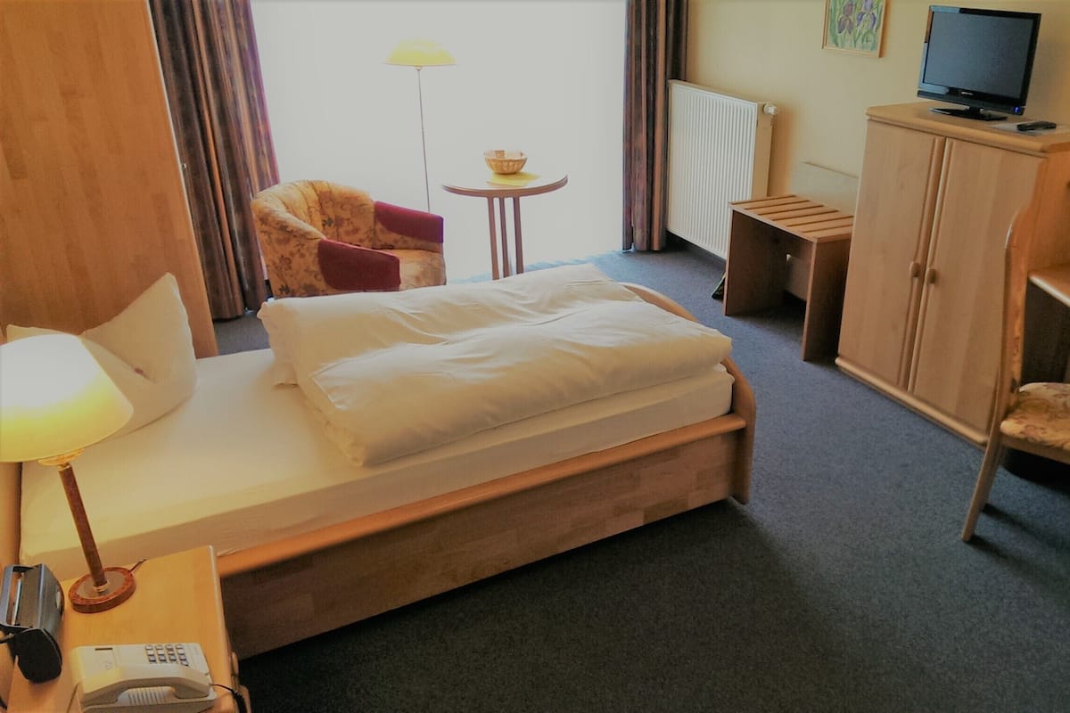 Desk, laptop workspace, blackout drapes, iron/ironing board