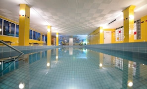 Indoor pool, pool umbrellas, pool loungers