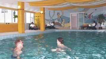 Indoor pool, pool umbrellas, pool loungers