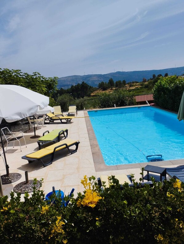 Outdoor pool, pool umbrellas, pool loungers