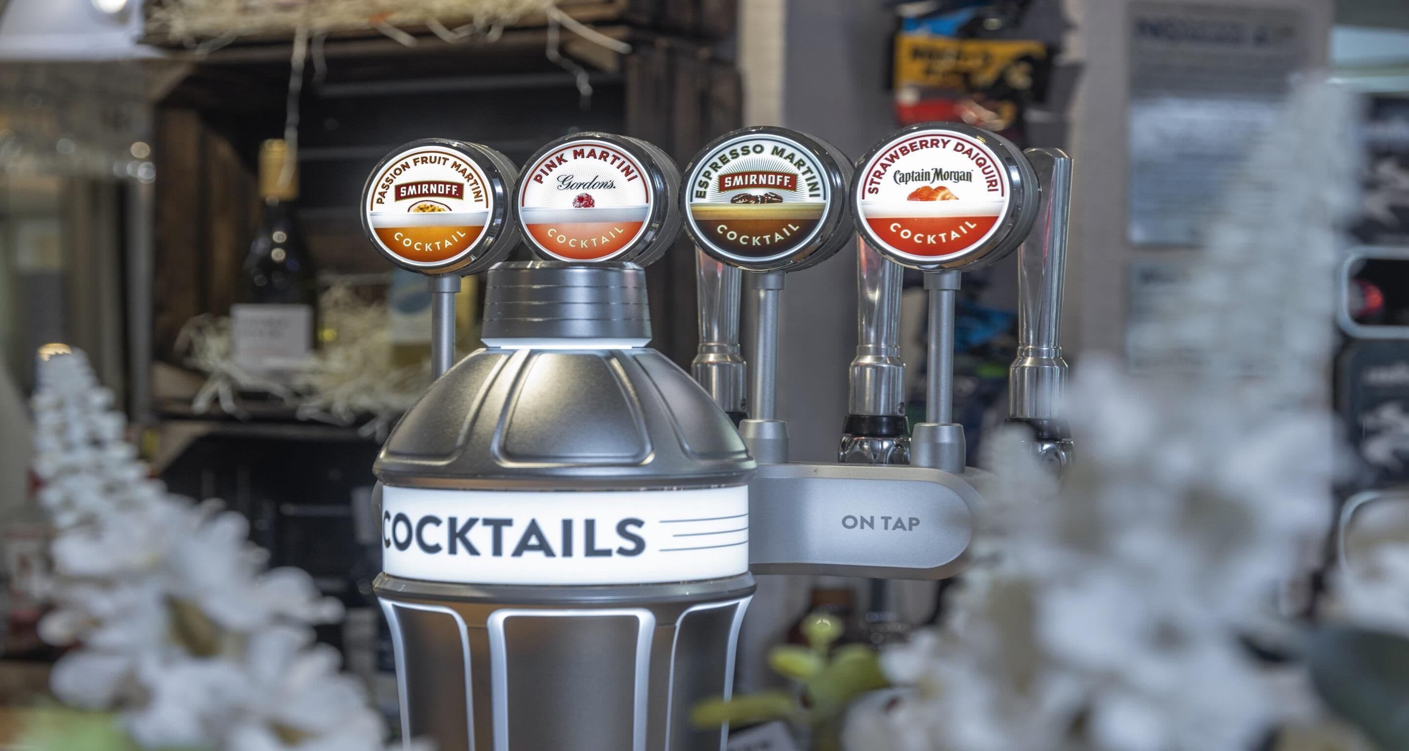 A tap labeled "COCKTAILS" with four different cocktail options.