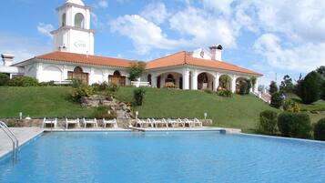Indoor pool, outdoor pool, pool umbrellas