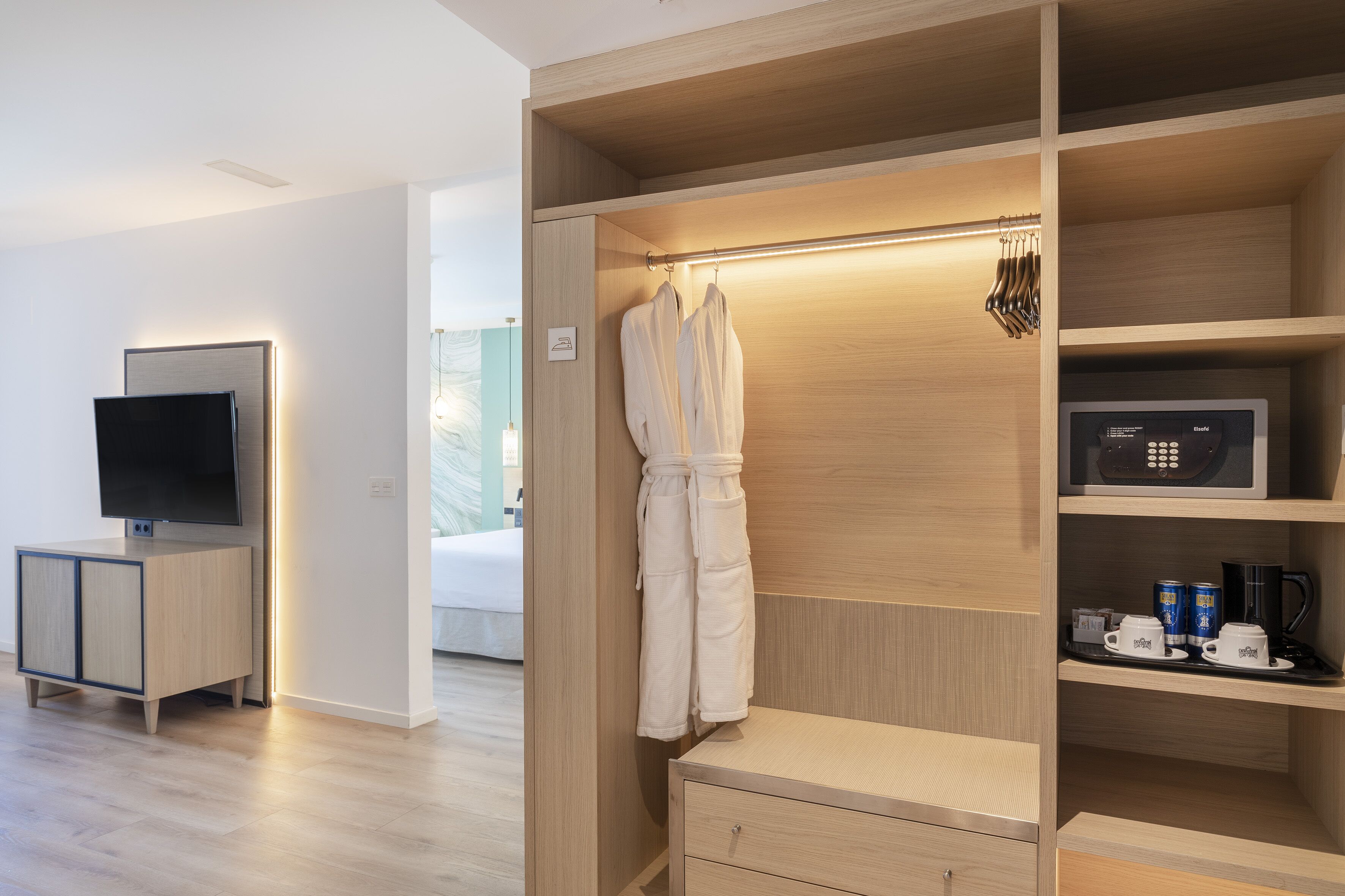 junior suite, sea view | minibar, in-room safe, blackout curtains, iron/ironing board