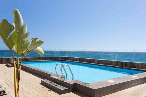 Outdoor pool, pool umbrellas, pool loungers