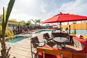 Outdoor pool, a heated pool, open 8:00 AM to 10:00 PM, pool umbrellas