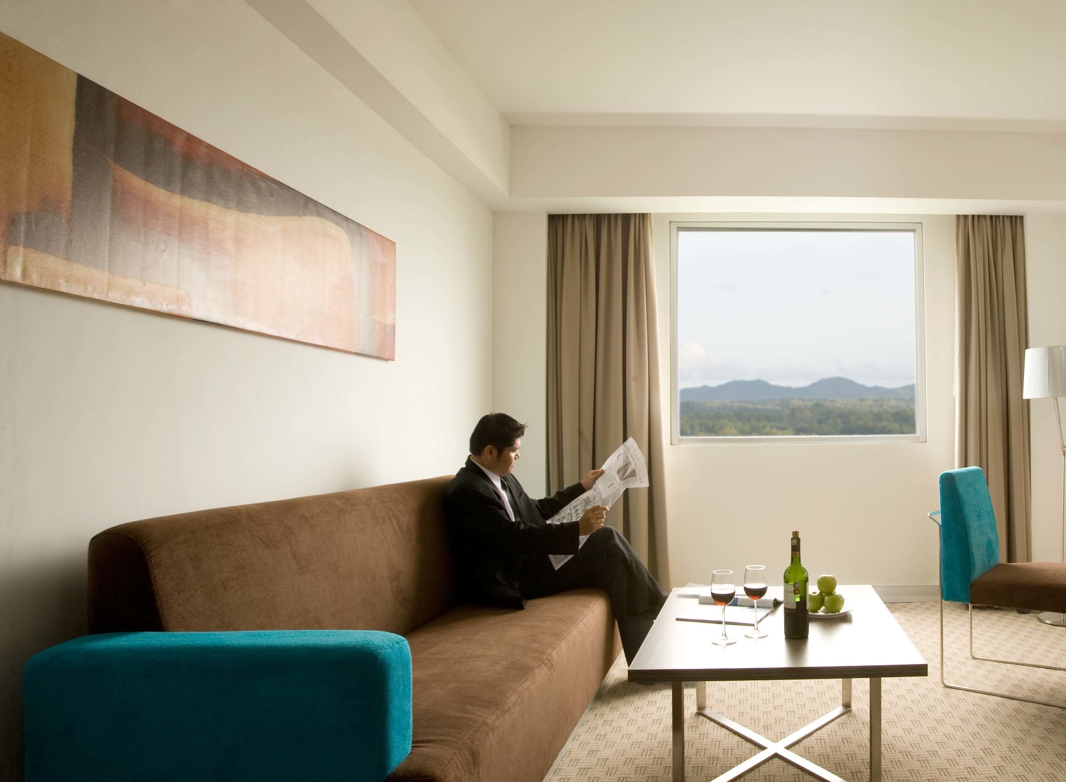 junior suite, 1 king bed | living area | 29-inch tv with cable channels