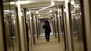 A corridor with glass doors and overhead lighting. - Novotel Bangka Hotel & Convention Centre (Pangkalpinang)