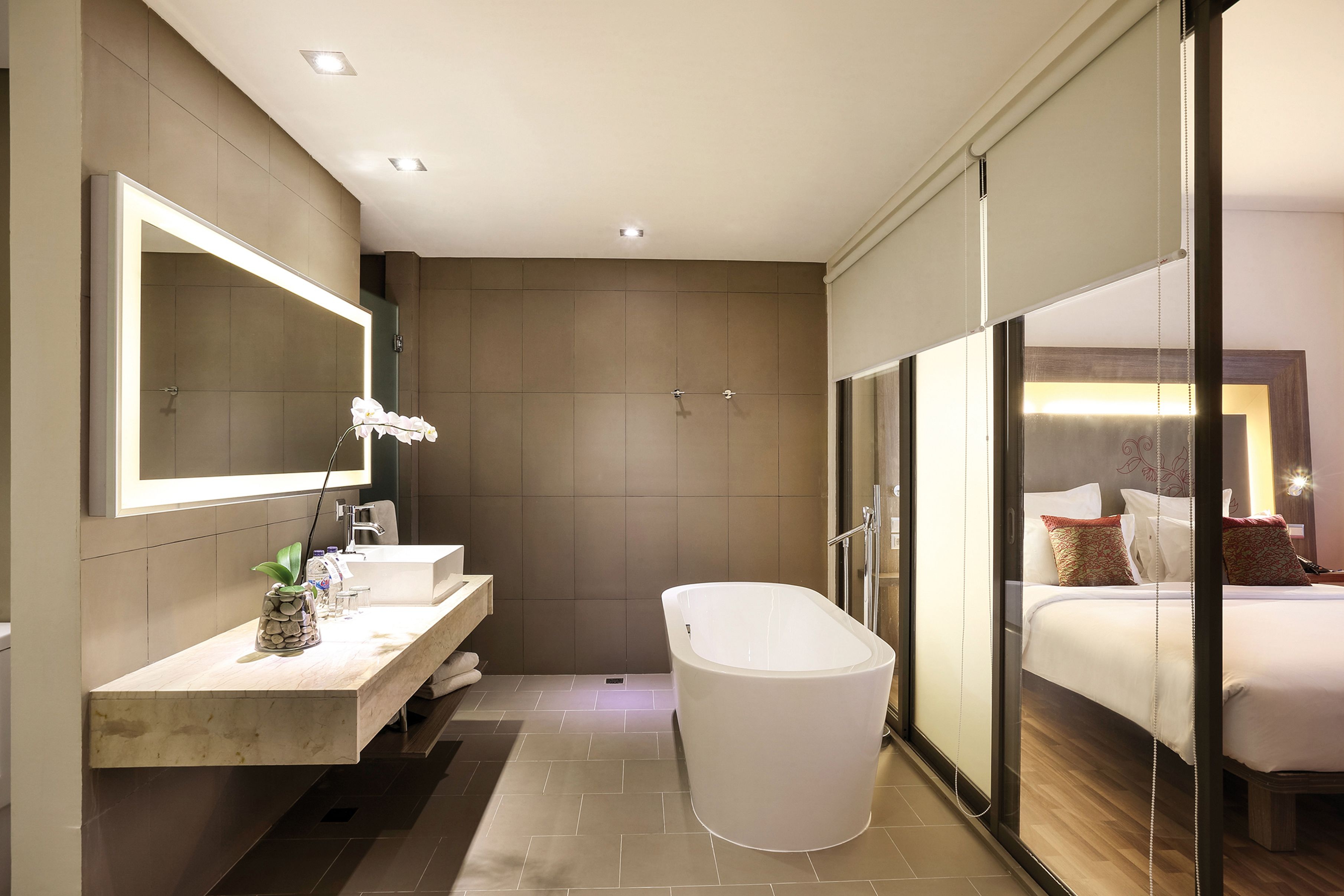 suite, 1 king bed | bathroom | eco-friendly toiletries, hair dryer, slippers, towels