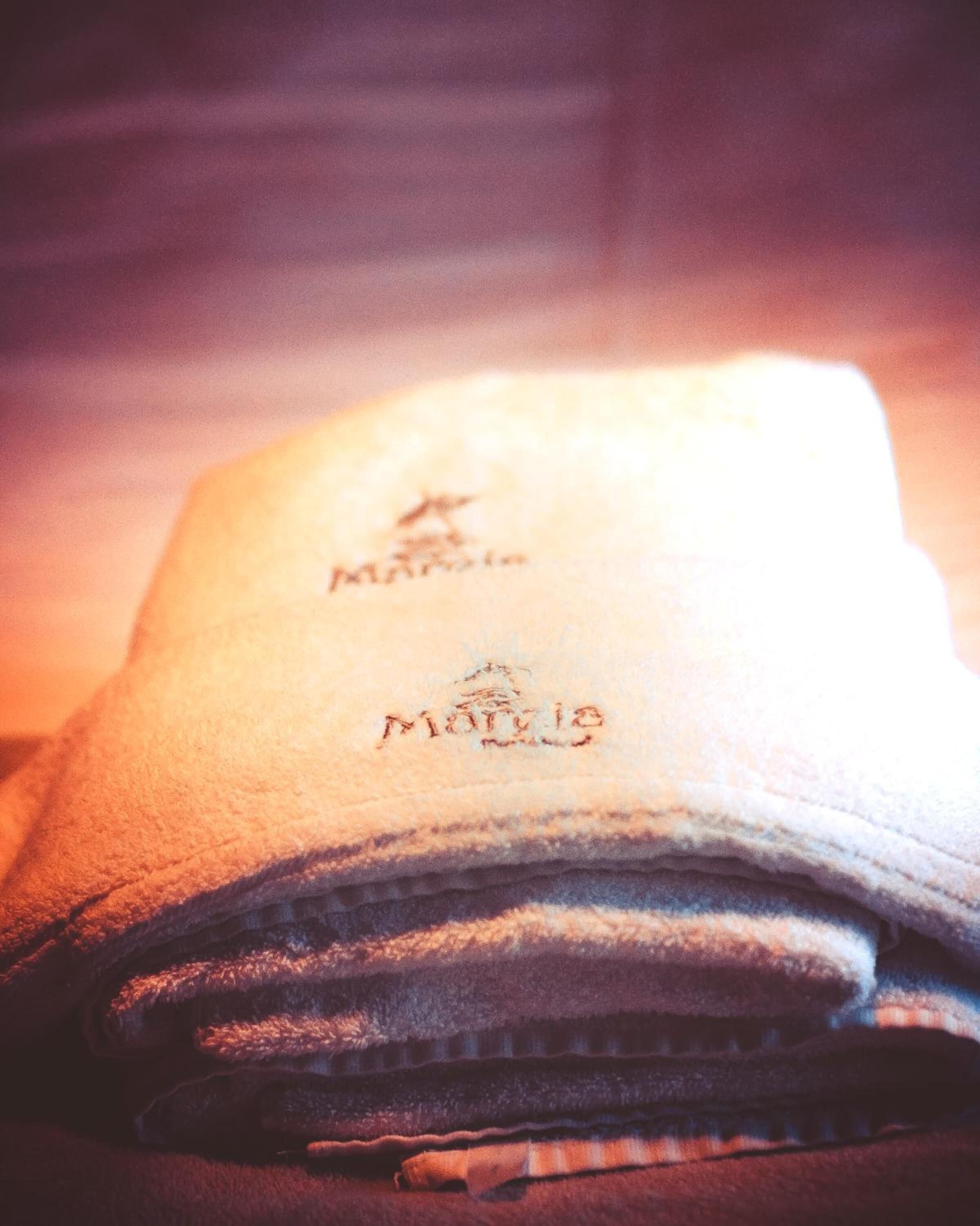 A close-up of a folded hat with the brand name "Marlboro" visible on the brim.