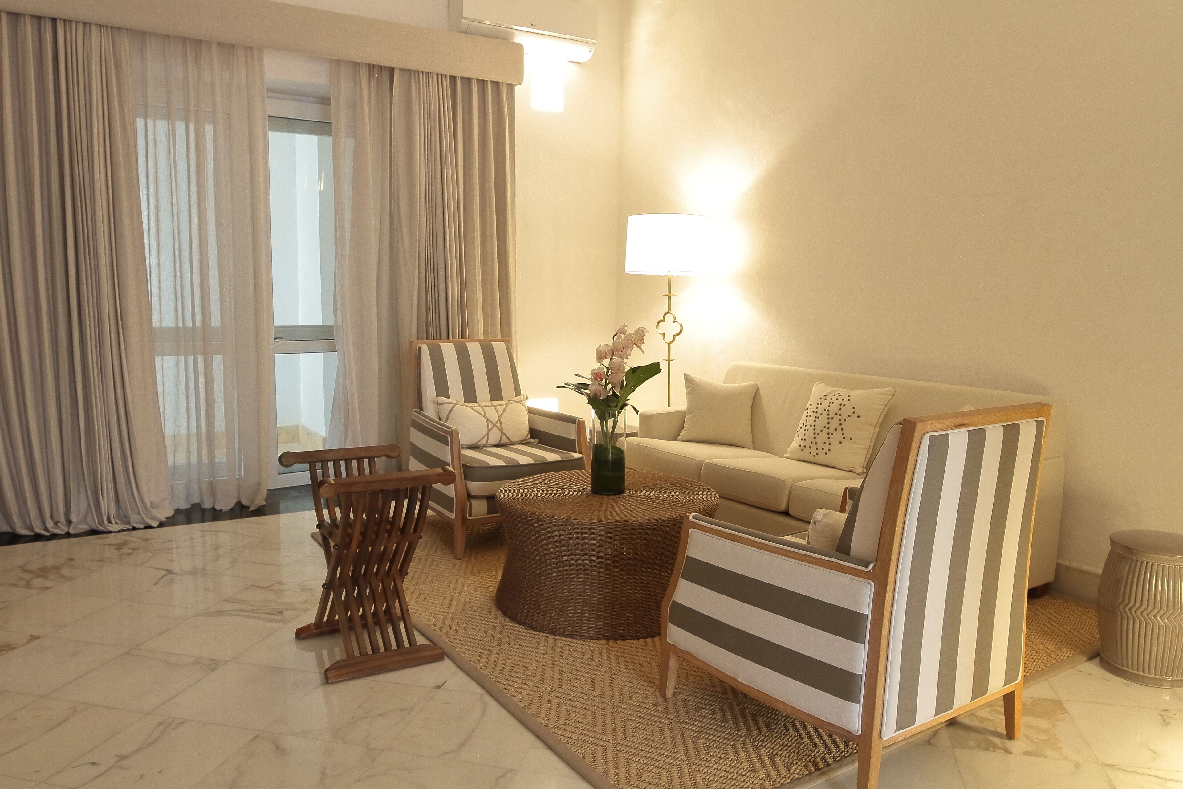 suite (madariaga) | living area | lcd tv, first-run films, pay films