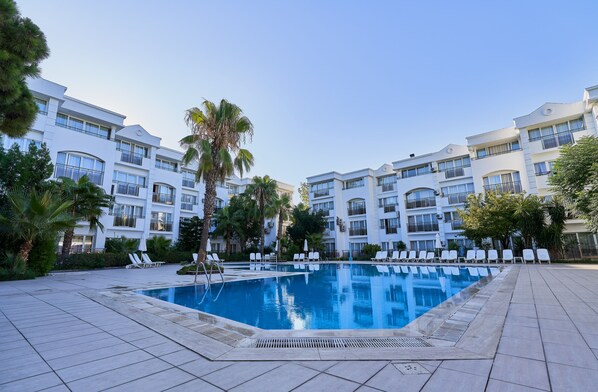 2 outdoor pools, pool umbrellas, pool loungers