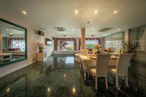 Grand Two Bedroom Residence Suite (Air Purifier) | Living area | 32-inch LCD TV with satellite channels, TV - Kodchasri Thani Hotel Chiangmai (Chiang Mai)