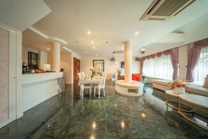 Grand Two Bedroom Residence Suite (Air Purifier) | Living room | 32-inch LCD TV with satellite channels, TV - Kodchasri Thani Hotel Chiangmai (Chiang Mai)