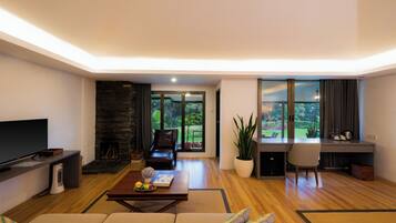 Premium Suite, 1 King Bed, Garden Area (Chalet) | Living area | 32-inch LCD TV with cable channels, TV