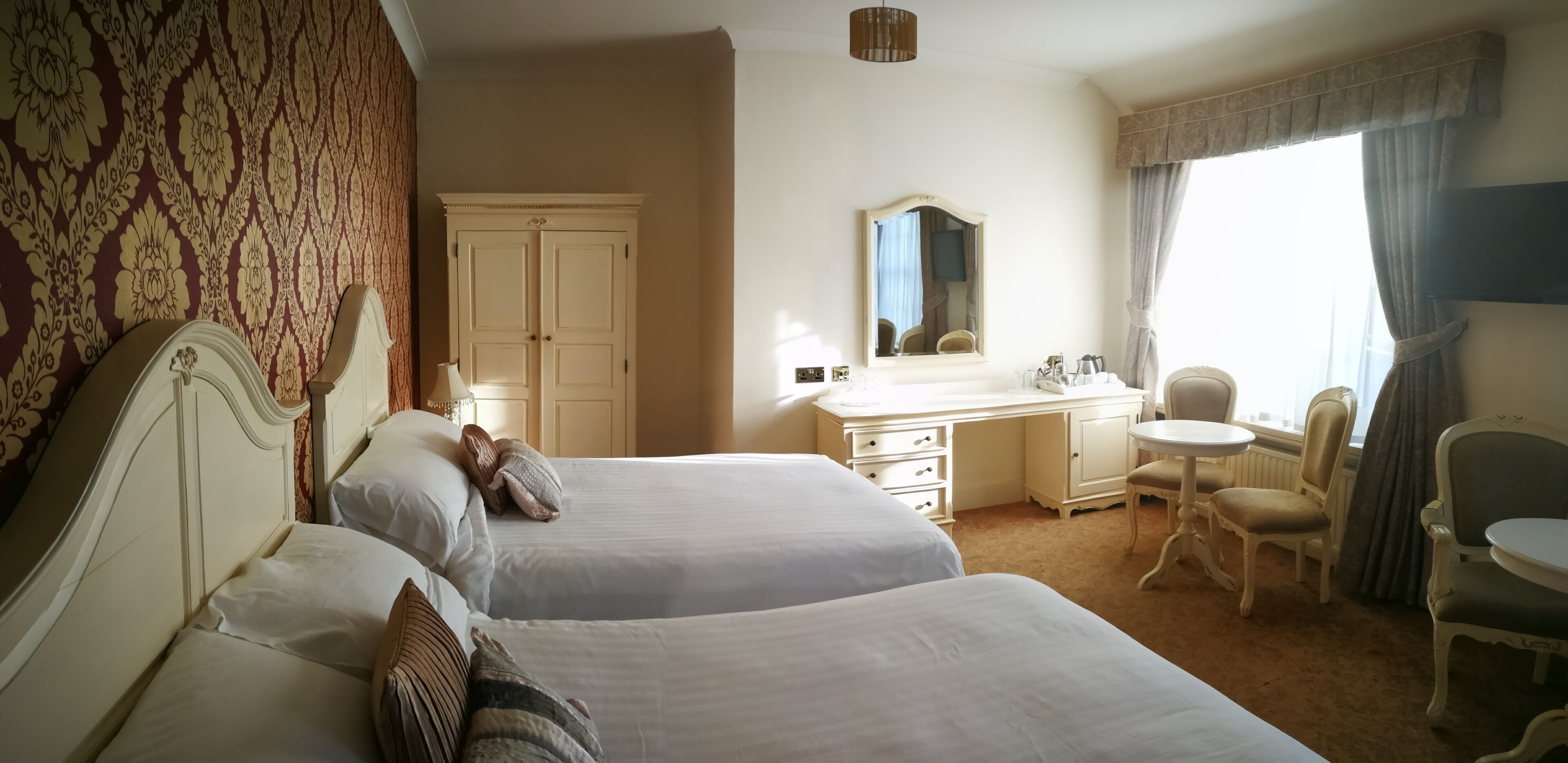 premium bedding, desk, laptop workspace, blackout curtains