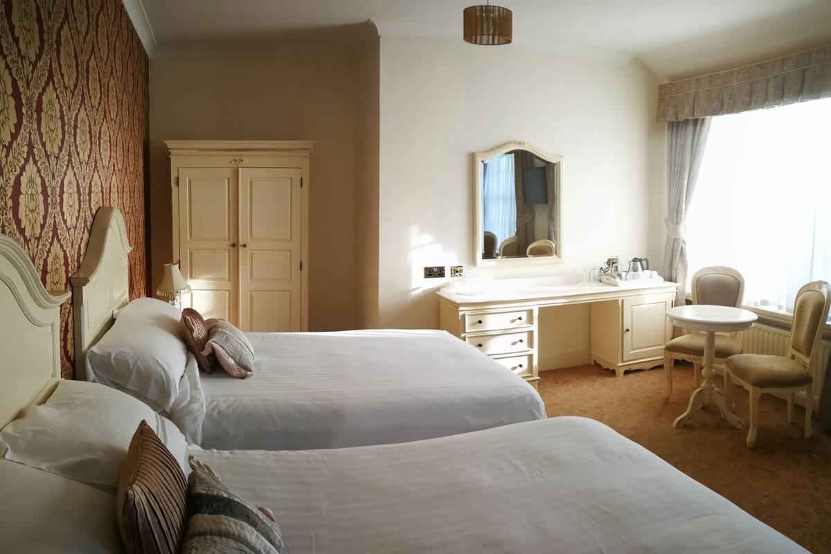 premium bedding, desk, laptop workspace, blackout curtains