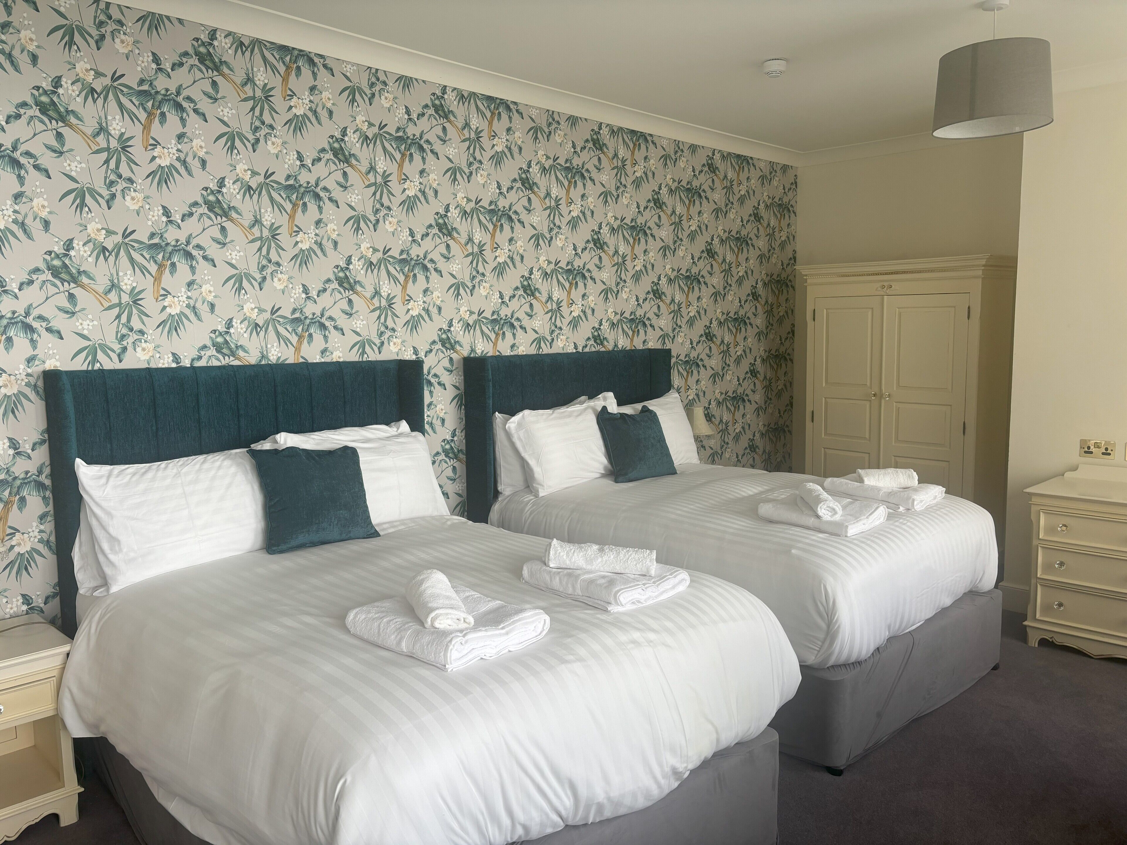 Premium bedding, desk, laptop workspace, blackout curtains