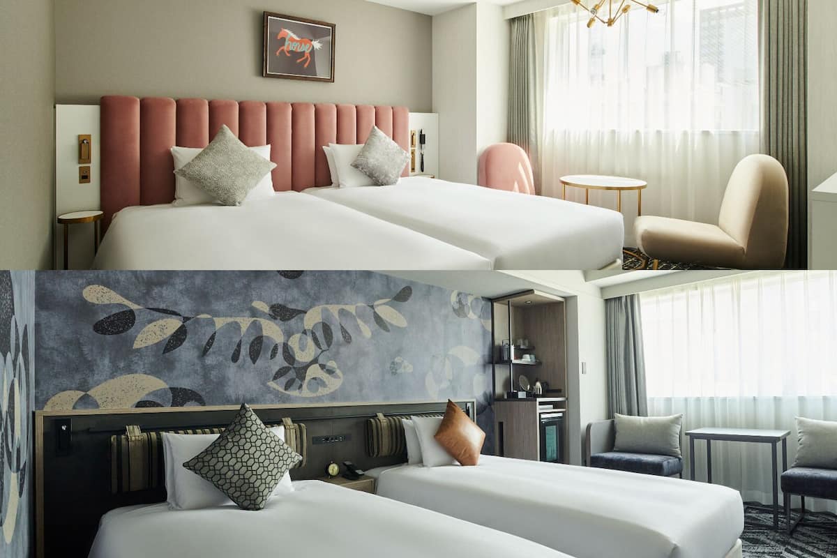A hotel room with a bed, a chair, a small table, a desk, and a window with curtains.