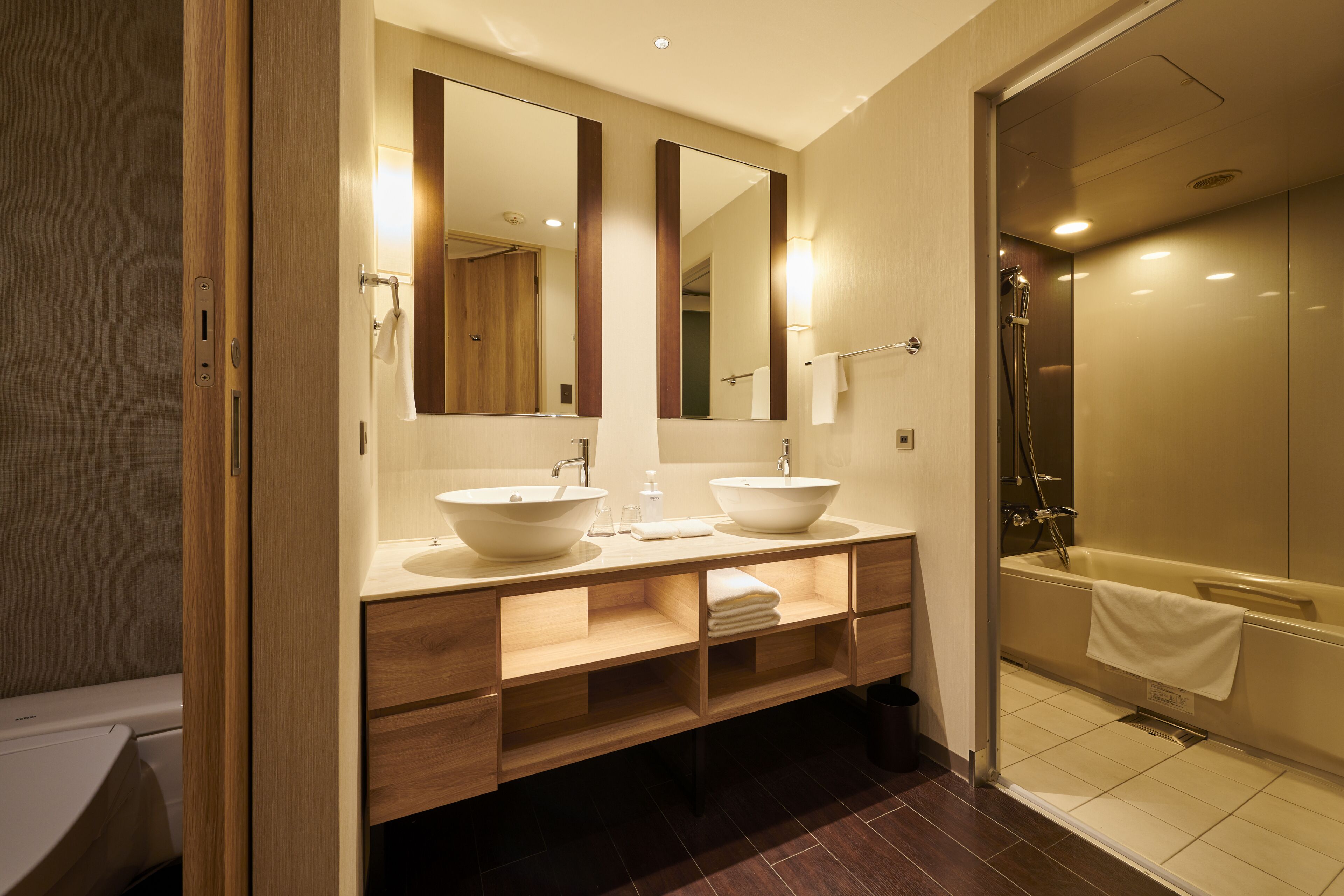 hair dryer, slippers, bidet, towels