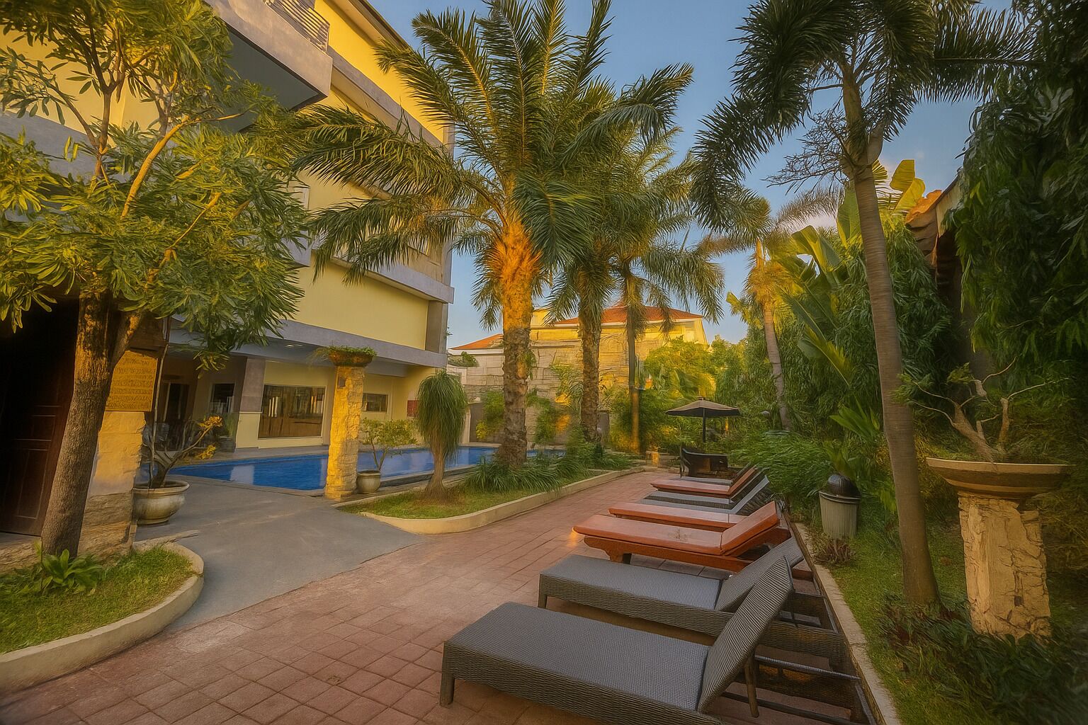 Outdoor pool, open 7:00 AM to 9:00 PM, pool umbrellas, pool loungers
